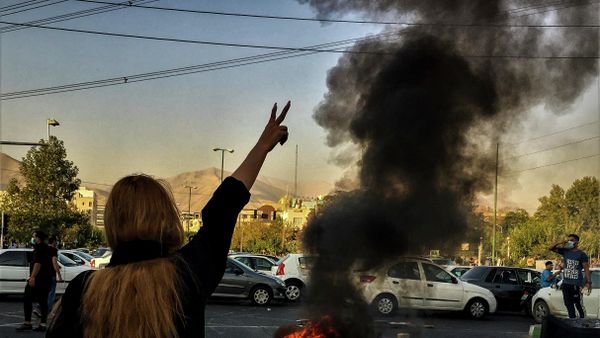 Iranians woman protests a 22-year-old woman Mahsa Amini's death after she was detained by the morality police, in Tehran, Saturday, Oct. 1, 2022. in this photo taken by an individual not employed by the Associated Press and obtained by the AP outside Iran. - Sputnik International