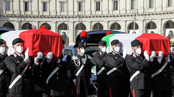 The coffins of the Italian ambassador to the Democratic Republic of Congo Luca Attanasio, right, and Italian Carabinieri police officer Vittorio Iacovacci are draped with the Italian flag ahead of their state funeral in Santa Maria degli Angeli church, in Rome, Thursday, Feb. 25, 2021. - Sputnik International