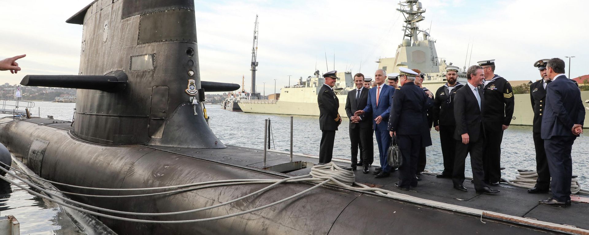 French President Emmanuel Macron (2nd L) and Australian Prime Minister Malcolm Turnbull (3rd L) stand on the deck of HMAS Waller, a Collins-class submarine operated by the Royal Australian Navy French President Emmanuel Macron (2nd L) and Australian Prime Minister Malcolm Turnbull (3rd L) stand on the deck of HMAS Waller, a Collins-class submarine operated by the Royal Australian Navy - Sputnik International, 1920, 27.10.2022