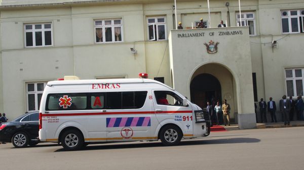 An ambulance is seen outside Zimbabwe's parliament following scuffles between police and opposition members of parliament during the 2018 Budget presentation in Harare, Thursday, Nov. 22, 2018. Police forcibly removed some opposition members of parliament after they refused to stand up for President Emmerson Mnangagwa, being accused of disrespect before police were called and scuffles ensued. - Sputnik International
