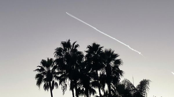A SpaceX Falcon 9 rocket streaks across the sky, as seen from Pasadena, after launching from Vandenberg Space Force Base, Calif., carrying 53 Starlink satellites into orbit, Thursday, Oct. 27, 2022. - Sputnik International