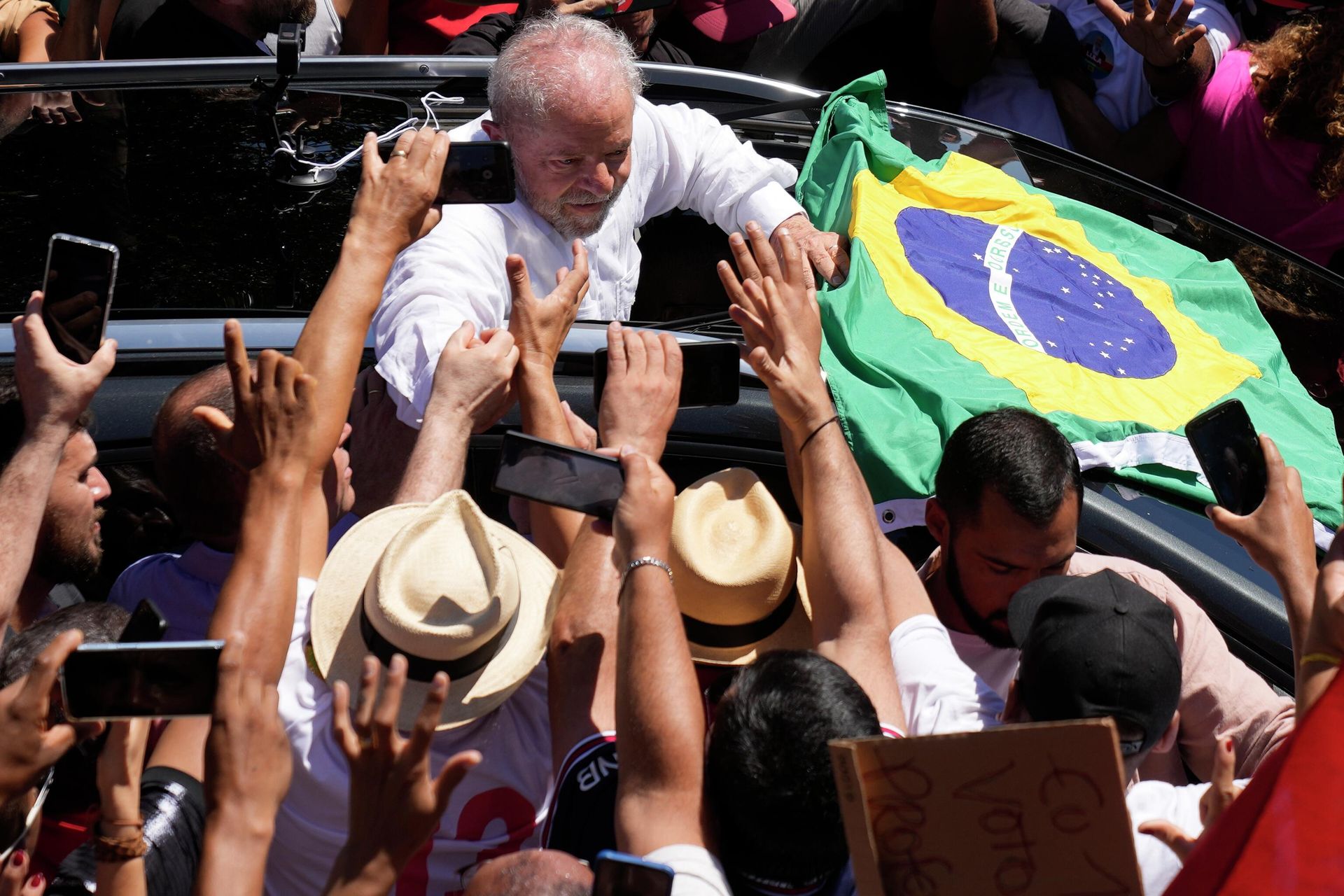 FILE - Former Brazilian President Luiz Inacio Lula da Silva, center, who was running for president again, hold hands with a supporter after voting in a presidential run-off election in Sao Paulo, Brazil, Oct. 30, 2022. In a victory speech Sunday, Brazil’s president-elect da Silva promised to reverse a surge in deforestation in the Amazon rainforest. FILE - Former Brazilian President Luiz Inacio Lula da Silva, center, who was running for president again, hold hands with a supporter after voting in a presidential run-off election in Sao Paulo, Brazil, Oct. 30, 2022. In a victory speech Sunday, Brazil’s president-elect da Silva promised to reverse a surge in deforestation in the Amazon rainforest. - Sputnik International, 1920, 01.11.2022