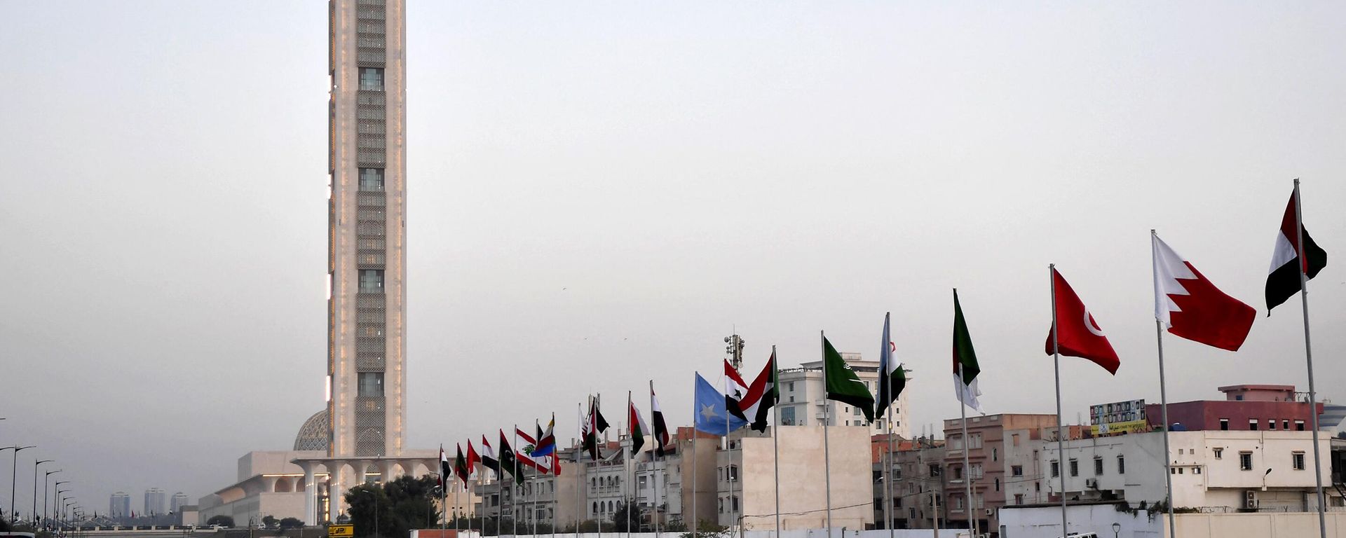 The flags of Arab League nations fly on October 31, 2022 along the side of a highway ahead of the Arab Summit meeting in Algeria's capital Algiers. - Sputnik International, 1920, 07.05.2023