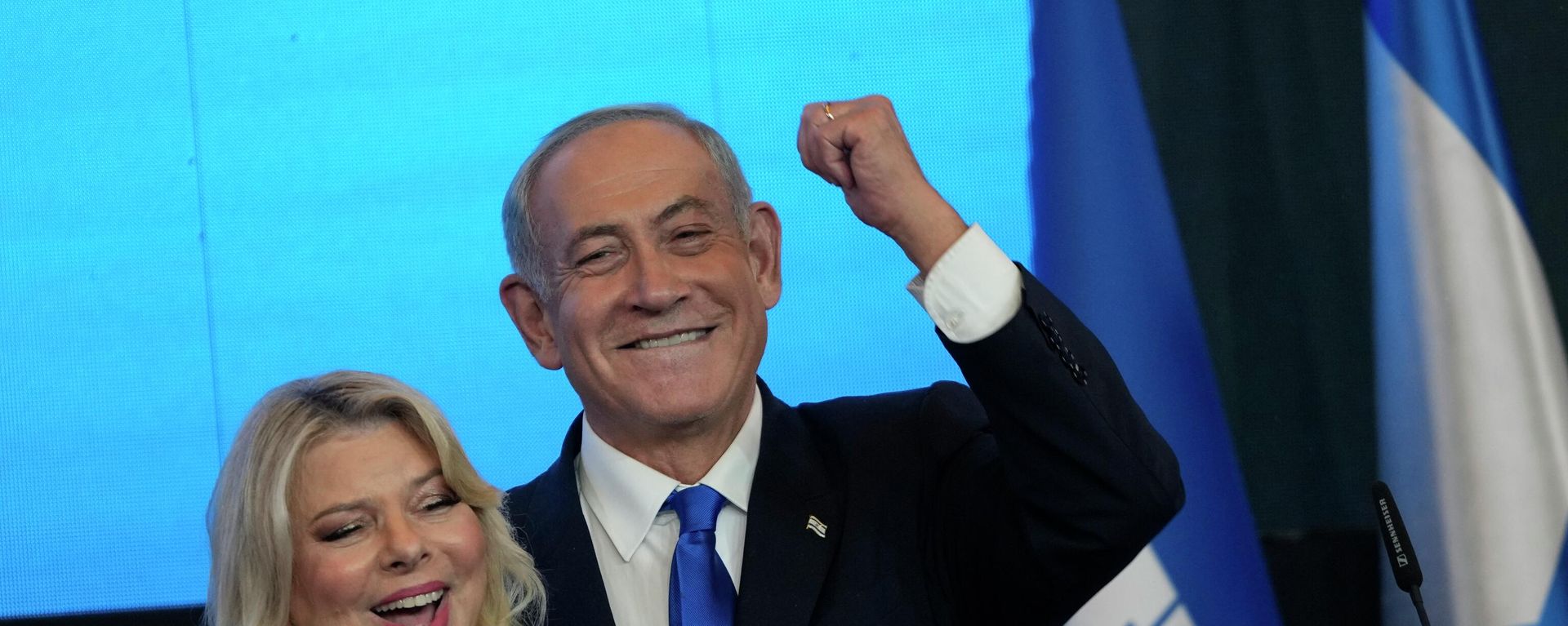 Former Israeli Prime Minister and the head of Likud party, Benjamin Netanyahu and his wife Sara gesture after first exit poll results for the Israeli Parliamentary election at his party's headquarters in Jerusalem, Wednesday, Nov. 2, 2022. Former Israeli Prime Minister and the head of Likud party, Benjamin Netanyahu and his wife Sara gesture after first exit poll results for the Israeli Parliamentary election at his party's headquarters in Jerusalem, Wednesday, Nov. 2, 2022. - Sputnik International, 1920, 02.11.2022