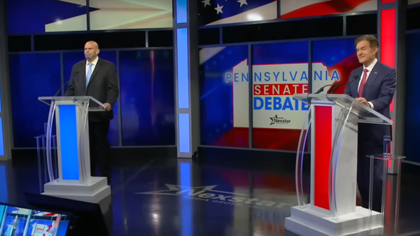 Democratic Candidate John Fetterman (left) and Republican Candidate Dr. Mehmet Oz (right) in their first and only debate October 25 in the race for Senate. - Sputnik International