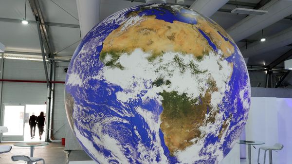 The American continent is seen on a revolving globe in a booth at the convention center hosting the COP27 U.N. Climate Summit, Saturday, Nov. 5, 2022, in Sharm el-Sheikh, Egypt. - Sputnik International