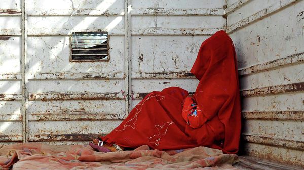 In this May 7, 2011 file photo, 7-year-old child bride sits in the back of a truck as she waits for the rest of her family members after being wed, at Biaora, about 135 kilometers from Bhopal, India. - Sputnik International