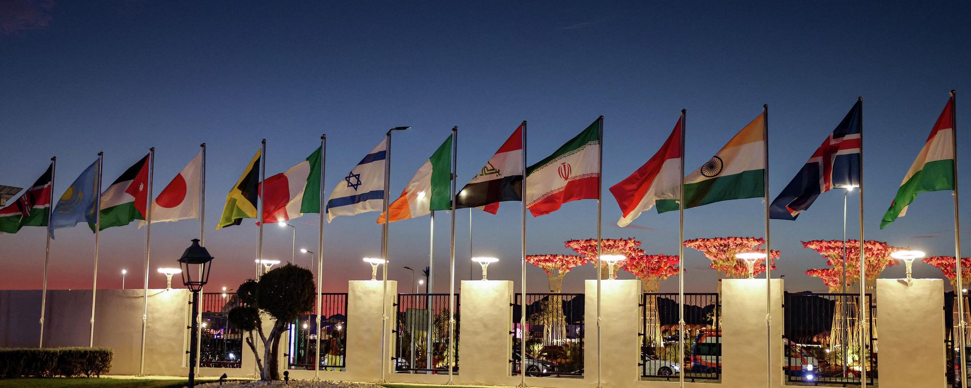 The flags of United Nations member states (R to L) Hungary, Iceland, India, Indonesia, Iran, Iraq, Ireland, Israel, Italy, Jamaica, Japan, Jordan, Kazakhstan, and Kenya fly in alphabetical order during the COP27 climate conference at the Sharm el-Sheikh International Convention Centre, in Egypt's Red Sea resort city of the same name, on November 7, 2022. The flags of United Nations member states (R to L) Hungary, Iceland, India, Indonesia, Iran, Iraq, Ireland, Israel, Italy, Jamaica, Japan, Jordan, Kazakhstan, and Kenya fly in alphabetical order during the COP27 climate conference at the Sharm el-Sheikh International Convention Centre, in Egypt's Red Sea resort city of the same name, on November 7, 2022. - Sputnik International, 1920, 11.11.2022