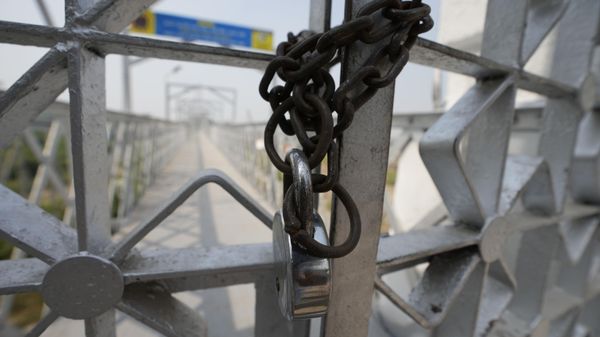 The entrance to a cable bridge that collapsed is seen locked in Morbi town of western state Gujarat, India, Tuesday, Nov. 1, 2022. - Sputnik International