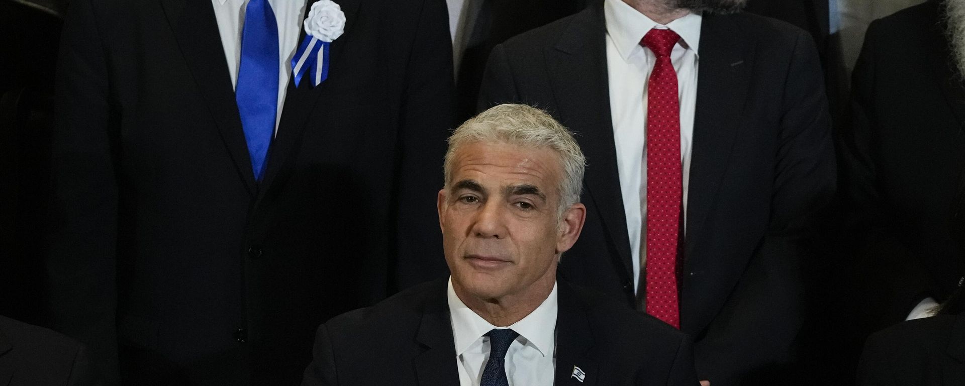 Israeli Prime Minister Yair Lapid, center, Likud Party leader Benjamin Netanyahu, left, far-right Israeli lawmaker Bezalel Smotrich and leaders of all Israel's political parties pose for a group photo after the swearing-in ceremony for Israeli lawmakers at the Knesset, Israel's parliament, in Jerusalem, Tuesday, Nov. 15, 2022. Israeli lawmakers were sworn in at the Knesset, on Tuesday, following national elections earlier this month. Israeli Prime Minister Yair Lapid, center, Likud Party leader Benjamin Netanyahu, left, far-right Israeli lawmaker Bezalel Smotrich and leaders of all Israel's political parties pose for a group photo after the swearing-in ceremony for Israeli lawmakers at the Knesset, Israel's parliament, in Jerusalem, Tuesday, Nov. 15, 2022. Israeli lawmakers were sworn in at the Knesset, on Tuesday, following national elections earlier this month. - Sputnik International, 1920, 20.12.2022