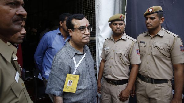 India's Congress Party leader and candidate Ajay Maken walks out from a counting station in New Delhi, India, Friday, May 16, 2014. - Sputnik International