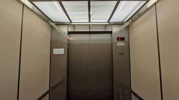 A vintage Montgomery hydraulic elevator interior that has a modified controller and interior at Macy's Westfield Montgomery in Maryland. - Sputnik International