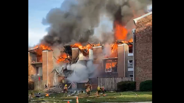 An apartment building in Gaithersburg, Maryland, erupts in flames following an explosion likely caused by a gas leak on November 16, 2022. - Sputnik International