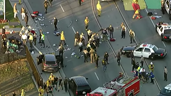 Image captures the aftermath moments after a vehicle plowed through a group of jogging police recruits in Los Angeles, California. - Sputnik International
