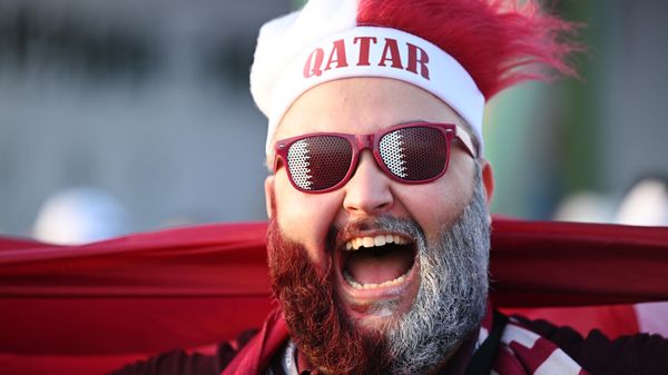 A football fan poses for a photo outside the stadium ahead of the 2022 FIFA World Cup Group A soccer match between Qatar and Ecuador, in Al Khor, Qatar. - Sputnik International