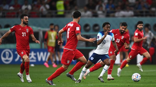 England’s Raheem Sterling, center, struggles for a ball during the Qatar 2022 World Cup Group B soccer match between England and Iran at the Khalifa International Stadium in Doha, Qatar. - Sputnik International