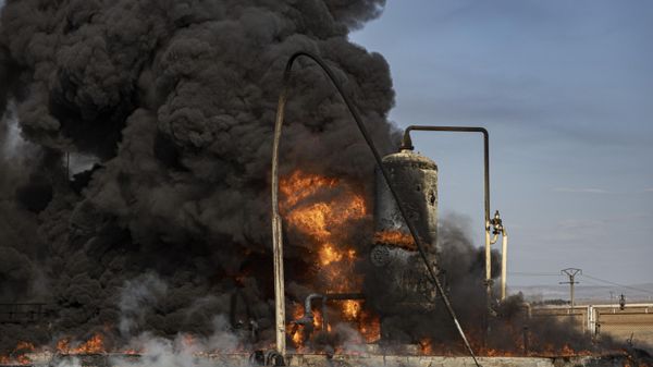 A smoke rises from an oil depot struck by Turkish air force near the town of Qamishli, Syria, Wednesday, Nov. 23, 2022. Turkey's president says he will carry out a land invasion into Kurdish areas of northern Syria. Recep Tayyip Erdogan's statement in Ankara Wednesday came after Turkey carried out a barrage of airstrikes on suspected Kurdish militants in northern Syria and Iraq in recent days.  - Sputnik International