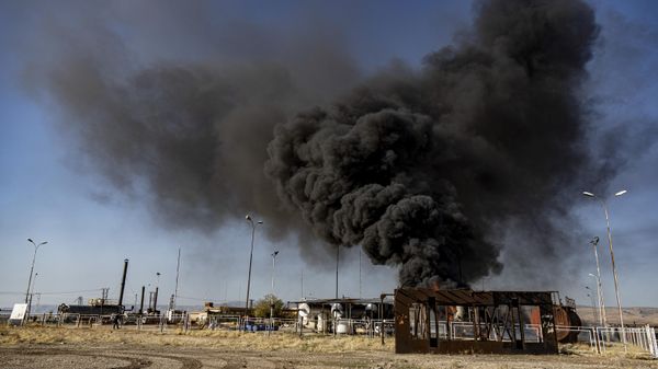 A smoke rises from an oil depot struck by Turkish air force near the town of Qamishli, Syria, Wednesday, Nov. 23, 2022. Turkey's president says he will carry out a land invasion into Kurdish areas of northern Syria. Recep Tayyip Erdogan's statement in Ankara Wednesday came after Turkey carried out a barrage of airstrikes on suspected Kurdish militants in northern Syria and Iraq in recent days. - Sputnik International