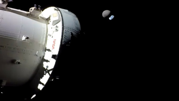 NASA's Orion spacecraft snapped a photo of an Earth eclipse by the moon during a distant retrograde orbit maneuver on November 28, 2022. During the orbit, Orion reached the furthest point a crew-rated spacecraft has ever been from Earth: 268,554 miles. - Sputnik International