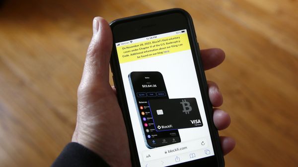 Text, in yellow, announcing cryptocurrency lender BlockFi's bankruptcy filing appears on the company website on a smart phone on Monday, Nov. 28, 2022, in New York. BlockFi said that it was filing for bankruptcy protection to stabilize its business and give it the chance to perform a restructuring. - Sputnik International