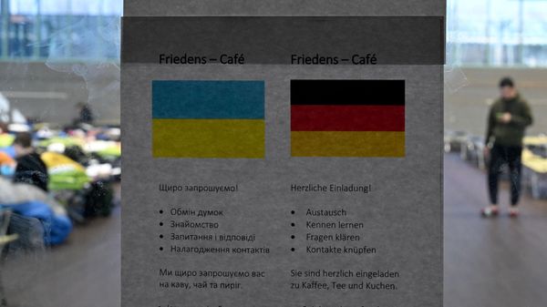 Information is given in Ukrainian and German language at an entrance door to a sports hall transformed into a shelter for Ukrainian  refugees in the small Bavarian village of Eichenau near Munich, southern Germany, on March 24, 2022. - Sputnik International