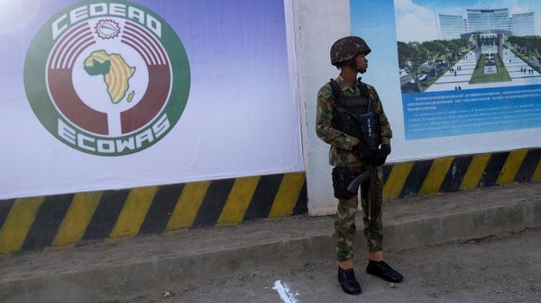 A Nigerian soldier stands outside the new construction site of the headquartes of the Economic Community of West African States (ECOWAS) during the ground-breaking ceremony at the 62nd Ordinary Session of ECOWAS Authority of Heads of State and Government in Abuja on December 4, 2022. - Sputnik International