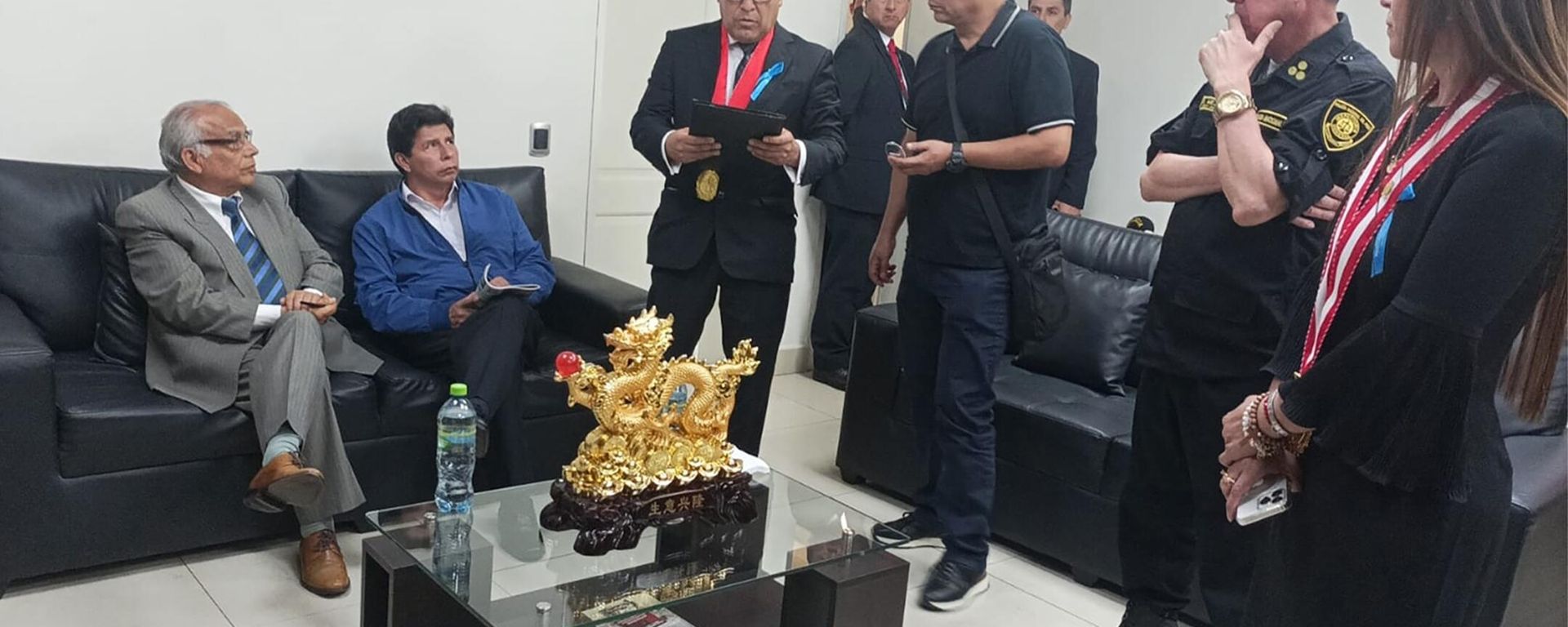 In this photo provided by Peru's police administration office, former President Pedro Castillo, second from left, and former Prime Minister Anibal Torres, far left, sit as prosecutor Marco Huaman stands at center inside a police station, where Castillo and Torres' status was not immediately clear, in Lima, Peru, Wednesday, Dec. 7, 2022. Peru’s Congress removed Castillo from office Wednesday and replaced him with the vice president, shortly after the president decreed the dissolution of the legislature ahead of a scheduled vote to oust him. In this photo provided by Peru's police administration office, former President Pedro Castillo, second from left, and former Prime Minister Anibal Torres, far left, sit as prosecutor Marco Huaman stands at center inside a police station, where Castillo and Torres' status was not immediately clear, in Lima, Peru, Wednesday, Dec. 7, 2022. Peru’s Congress removed Castillo from office Wednesday and replaced him with the vice president, shortly after the president decreed the dissolution of the legislature ahead of a scheduled vote to oust him. - Sputnik International, 1920, 12.12.2022
