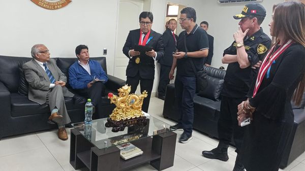 In this photo provided by Peru's police administration office, former President Pedro Castillo, second from left, and former Prime Minister Anibal Torres, far left, sit as prosecutor Marco Huaman stands at center inside a police station, where Castillo and Torres' status was not immediately clear, in Lima, Peru, Wednesday, Dec. 7, 2022. Peru’s Congress removed Castillo from office Wednesday and replaced him with the vice president, shortly after the president decreed the dissolution of the legislature ahead of a scheduled vote to oust him. - Sputnik International