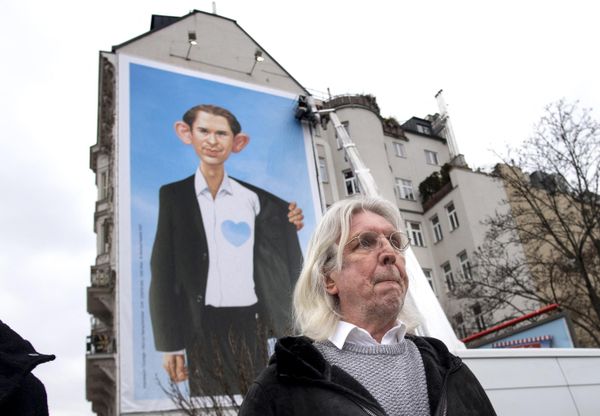 The famous Austrian artist and caricaturist Gerhard Haderer stands in front of a giant poster he created featuring Austrian Chancellor Sebastian Kurz, during a media event titled "Refugees by Initiative Courage" near the Naschmarkt market in Vienna, Austria on March 9, 2021. - Sputnik International