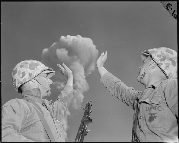 Operation name: Tumbler-Snapper. Date and time: May 1, 1952, 08:30. Test location: Range in Nevada. Explosion type, explosive placement: aerial, airdrop. Explosion height: 316 m. Yield: 19 kilotons. Marine infantry Pot and Wilson "supporting" the atomic mushroom during the Desert Rock IV exercise. A B-45 Tornado jet bomber dropped a modified TX-7 bomb with a capacity of 19 kilotons. Two hours after detonation, troops maneuvered to the explosion's epicenter to assess its impact on the military equipment and facilities located there.  - Sputnik International