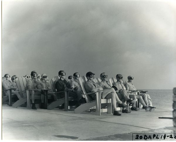 VIP spectators illuminated by the flash of an 81 kiloton charge detonating at Enewetak Atoll. - Sputnik International