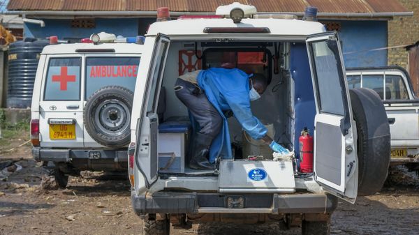 A man wearing protective clothing washes the interior of an ambulance used to transport suspected Ebola victims, in the town of Kassanda in Uganda, Tuesday, Nov. 1, 2022.  - Sputnik International