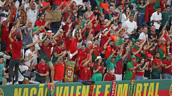 Portugal supporters celebrate during the Qatar 2022 World Cup round of 16 football match between Portugal and Switzerland at Lusail Stadium in Lusail, north of Doha on December 6, 2022.  - Sputnik International