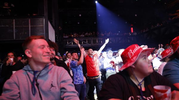 England fans celebrate their team's third goal as they watch the Qatar 2022 World Cup Group B football match between England and Iran being shown at the BUDX FIFA Fan Festival at Outernet in London on November 21, 2022. (Photo by CARLOS JASSO / AFP) - Sputnik International