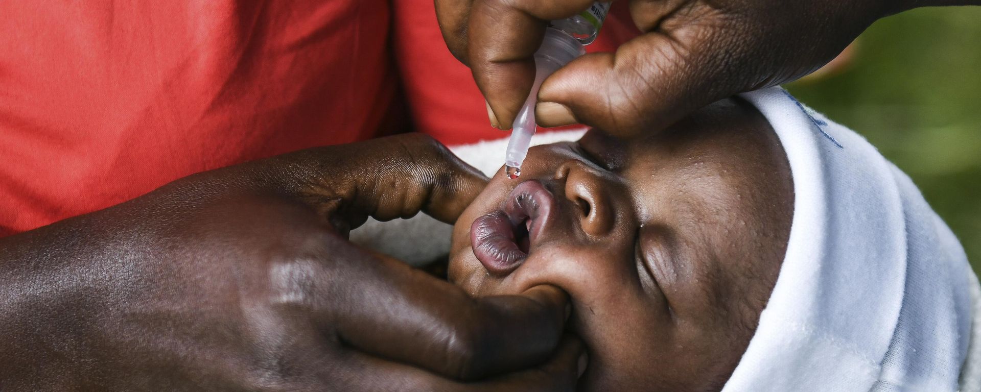 A baby receives a polio vaccine during the Malawi Polio Vaccination Campaign Launch in Lilongwe, Malawi, on March 20, 2022. A baby receives a polio vaccine during the Malawi Polio Vaccination Campaign Launch in Lilongwe, Malawi, on March 20, 2022. - Sputnik International, 1920, 29.01.2023