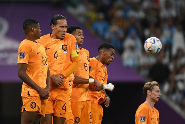 Dutch players Denzel Dumfries, Virgil van Dijk, and Cody Gakpo (left to right) in the World Cup quarterfinal match between the Netherlands and Argentina. - Sputnik International