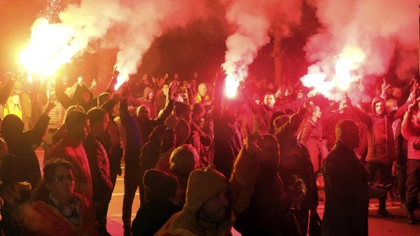 Protesters light torches during a rally in front of the parliament building in Podgorica, Montenegro, Monday, Dec. 12, 2022. Clashes erupted on Monday during an opposition protest in Montenegro reflecting a deep political crisis between the pro-Western and pro-Serb and pro-Russian camps in the small Balkan country that is a member of NATO. - Sputnik International