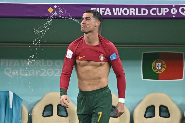 Portugal's forward #07 Cristiano Ronaldo spits out water during the Qatar 2022 World Cup round of 16 football match between Portugal and Switzerland at the Lusail Stadium in Lusail, north of Doha, December 6, 2022. - Sputnik International