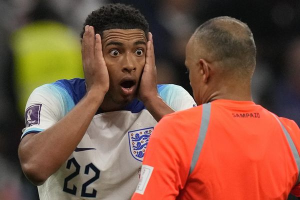 England's Jude Bellingham reacts in front of referee Wilton Sampaio during the World Cup quarterfinal soccer between England and France at the Al Bayt Stadium in Al Khor, Qatar, Saturday, December 10, 2022. - Sputnik International