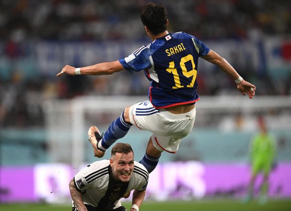 Germany's David Raum and Japan's Hiroki Sakai, right, during the World Cup group stage match between Germany and Japan. - Sputnik International