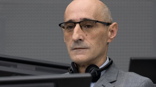 Salih Mustafa, a former Kosovo rebel, waits in the Kosovo Specialist Chambers court for the judges to read the verdict in The Hague, on December 16, 2022. - Sputnik International