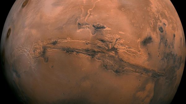 This mosaic of Mars is a compilation of images captured by the Viking Orbiter 1. The center of the scene shows the entire Valles Marineris canyon system, more than 2,000 miles (3,000 kilometers) long, 370 miles (600 kilometers) wide and 5 miles (8 kilometers) deep, extending from Noctis Labyrinthus, the arcuate system of graben to the west, to the chaotic terrain to the east. - Sputnik International