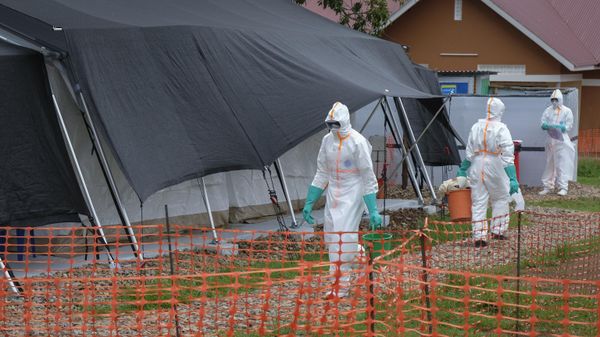 Medical workers walk inside the Ebola isolation center of Madudu Health Center III, in the village of Madudu, in the Mubende district of Uganda Tuesday, Nov. 1, 2022. - Sputnik International