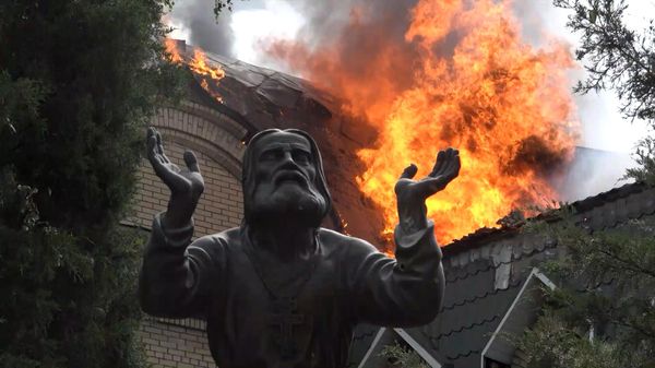 Screen from correspondent Valentin Trushnin's report 'Monastery: Through Heaven and Hell' about the evacuation of civilians from a Donetsk monastery under Ukrainian fire. - Sputnik International
