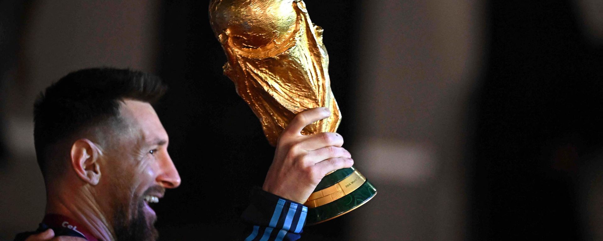 Argentina's captain and forward Lionel Messi holds the FIFA World Cup Trophy on December 20, 2022.  - Sputnik International, 1920, 20.01.2023