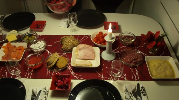 A slightly more modern version of the traditional Finnish joulupöytä Christmas meal. This dinner includes potato casserole, rosolli, gravlax, caviar, herring, olives, and various cheeses. The traditional Christmas ham has been replaced with a soy version. - Sputnik International