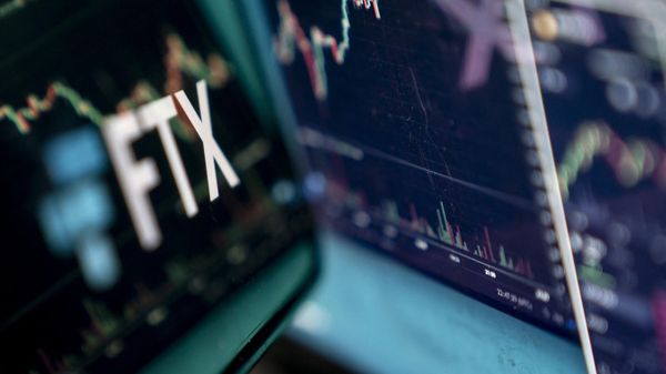 This photo illustration shows the logo of cryptocurrency FTX, reflected in its website on a laptop screen in Washington, DC, on November 13, 2022. - Sputnik International