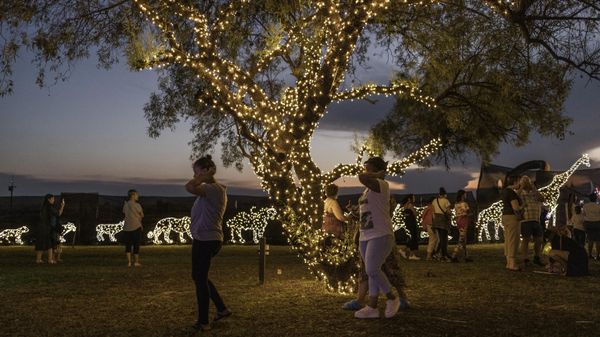 Visitors gather at a Christmas light fair at the Abraham Kriel Children’s home in Potchefstroom, on December 22, 2022. - Sputnik International