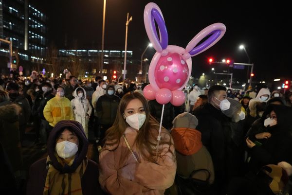 Revelers gather before a countdown to the New Year at Shougang Park in Beijing on Saturday, Dec. 31, 2022. - Sputnik International