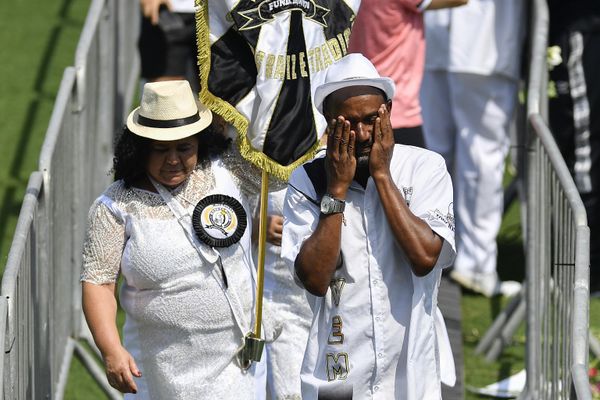 A fan of Pele wipes tears in a line of people waiting to pay their last respects to the late Brazilian footballgreat, lying in state at Vila Belmiro stadium, in Santos, Brazil, Monday, Jan. 2, 2023. - Sputnik International